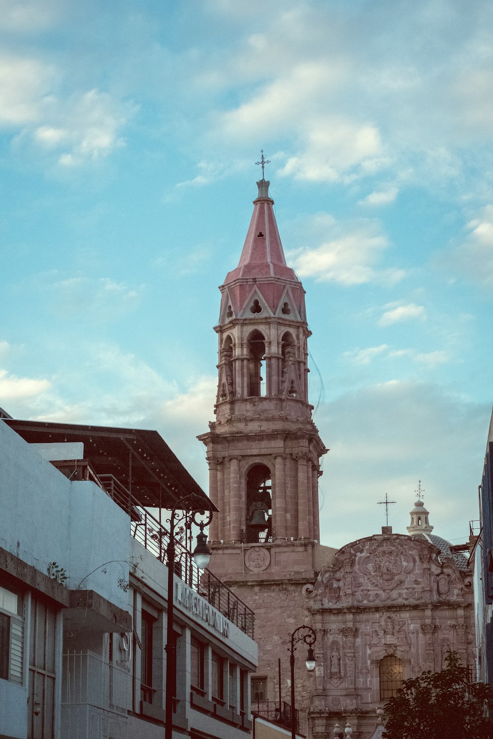 a tall clock tower towering over a city