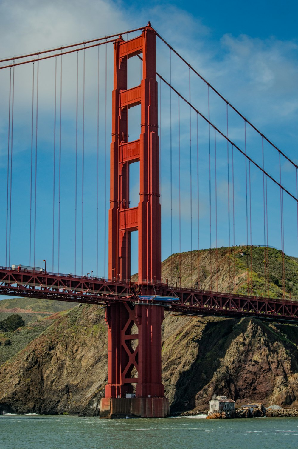 a boat is going under the golden gate bridge