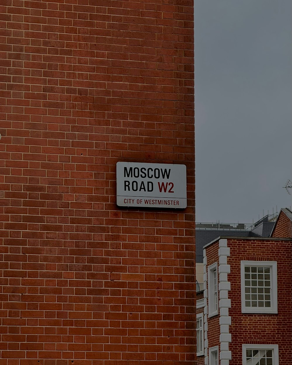 a red brick building with a sign on it