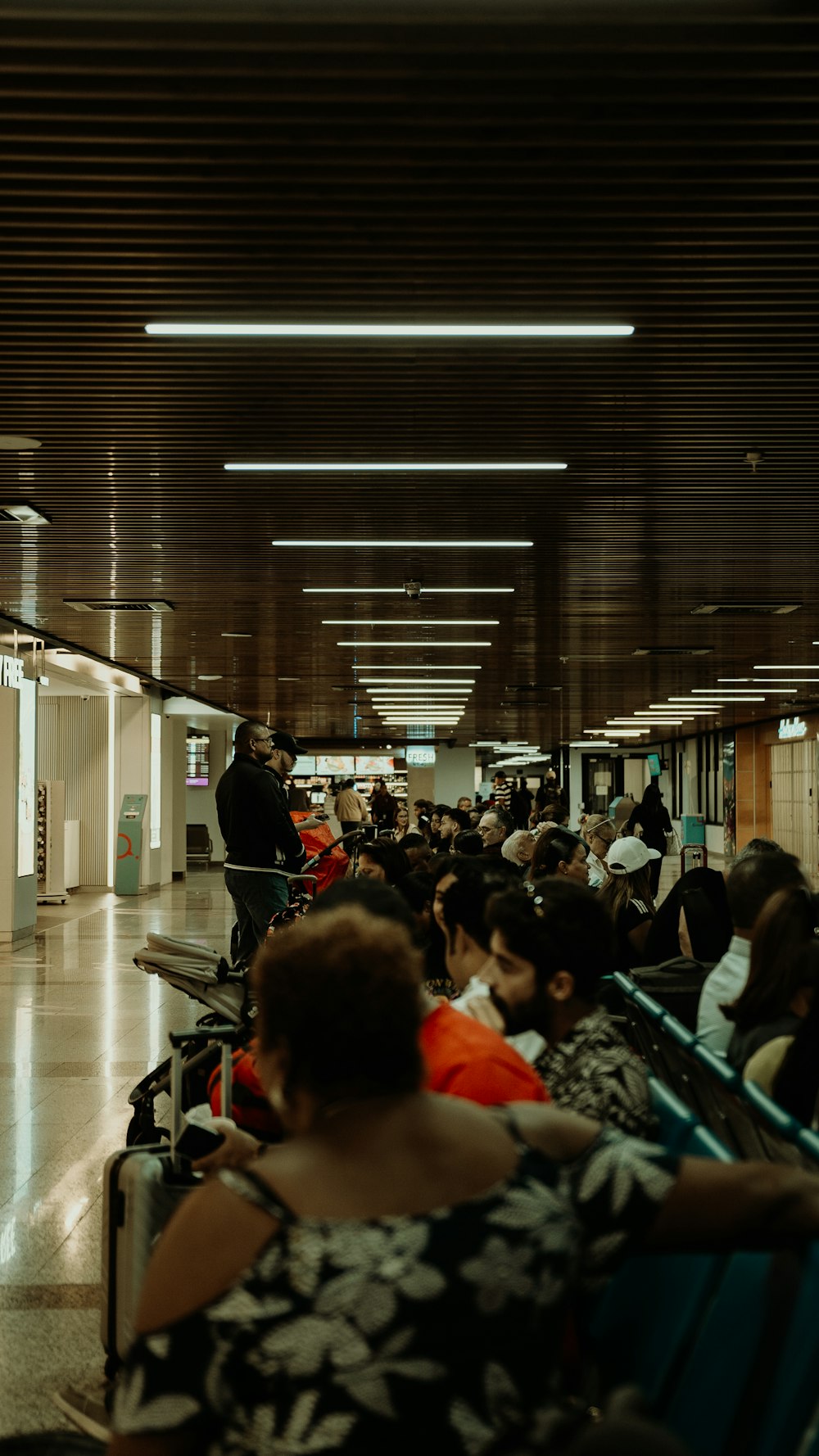 a group of people sitting in a waiting area
