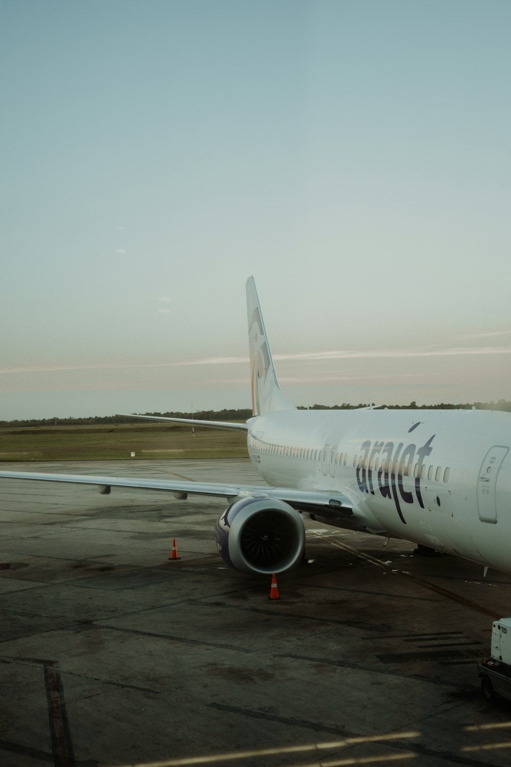 a large jetliner sitting on top of an airport tarmac