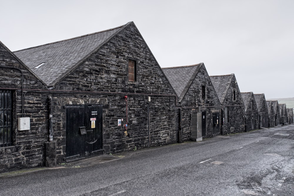 a row of stone buildings sitting next to each other