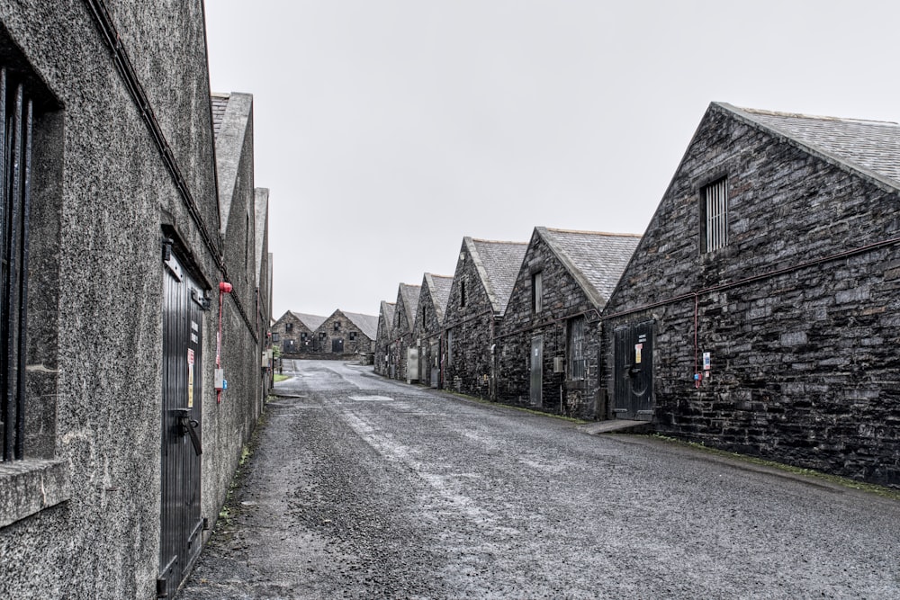 a street lined with stone buildings next to each other