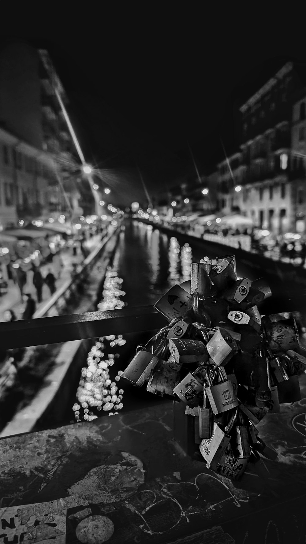 a black and white photo of a bunch of locks