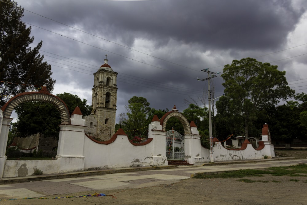 an old church with a clock tower in the background