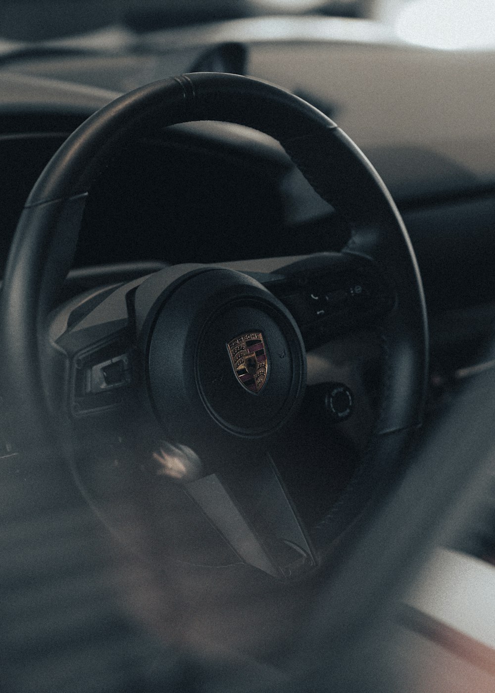 a close up of a steering wheel of a car