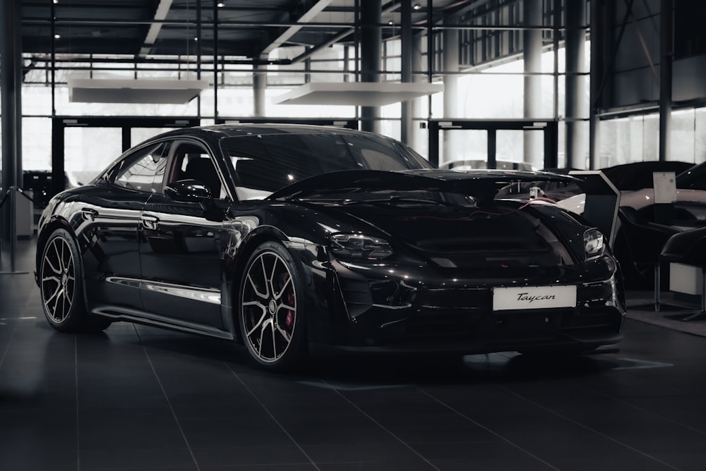 a black sports car parked in a garage