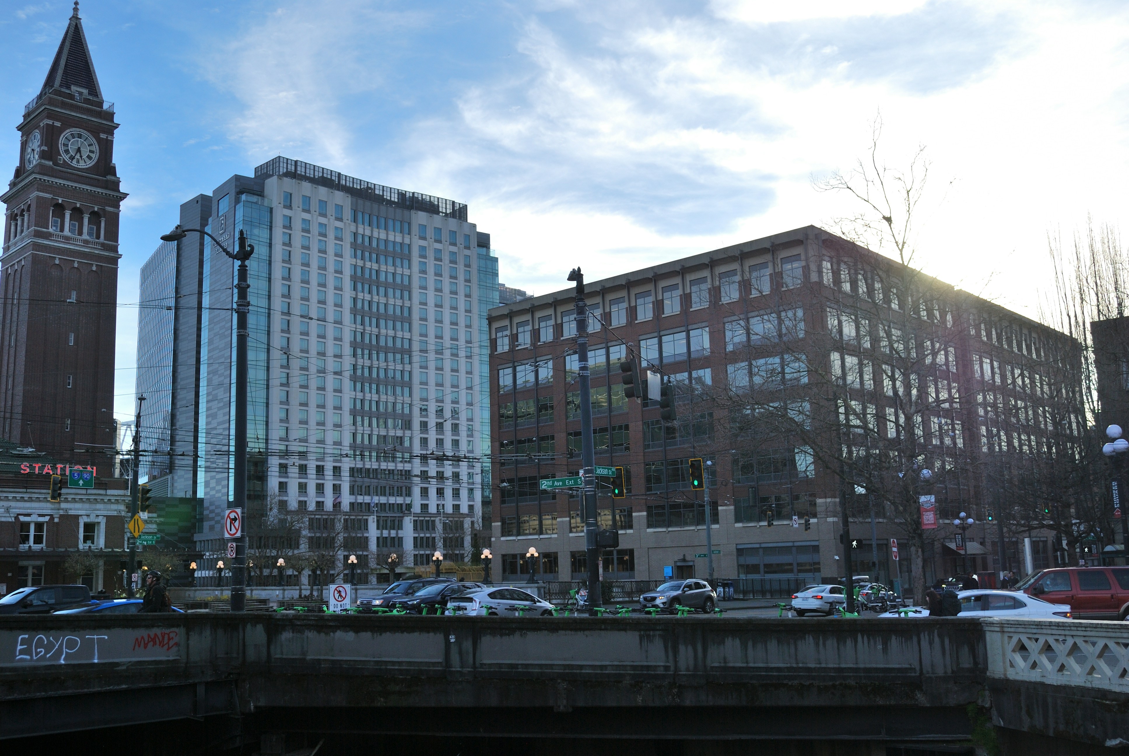 A view of a city with tall buildings and a clock tower