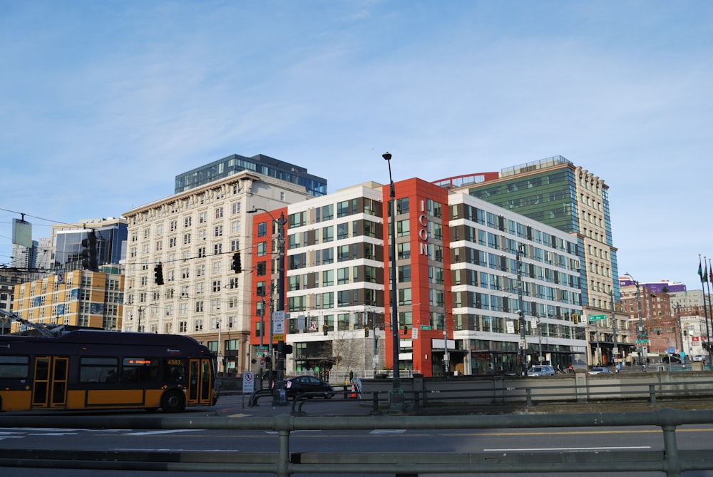 a bus is parked in front of a large building