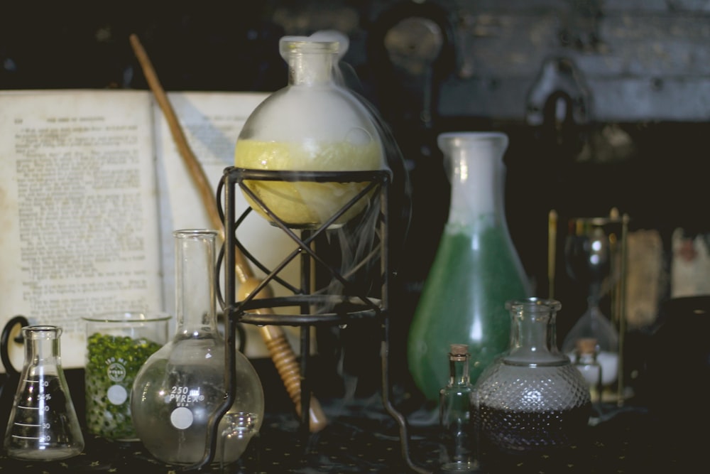 a table topped with lots of glass bottles