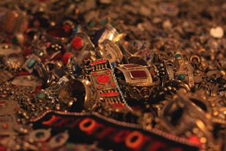 a pile of jewelry sitting on top of a table