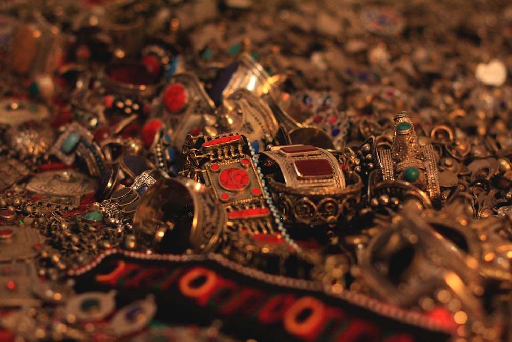 a pile of jewelry sitting on top of a table