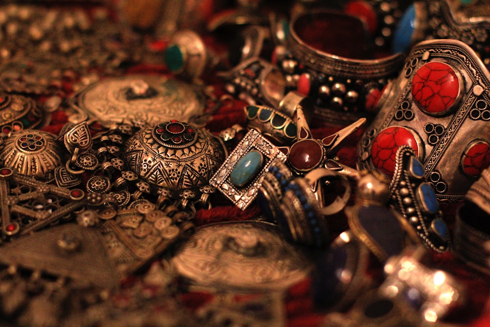 a pile of jewelry sitting on top of a table