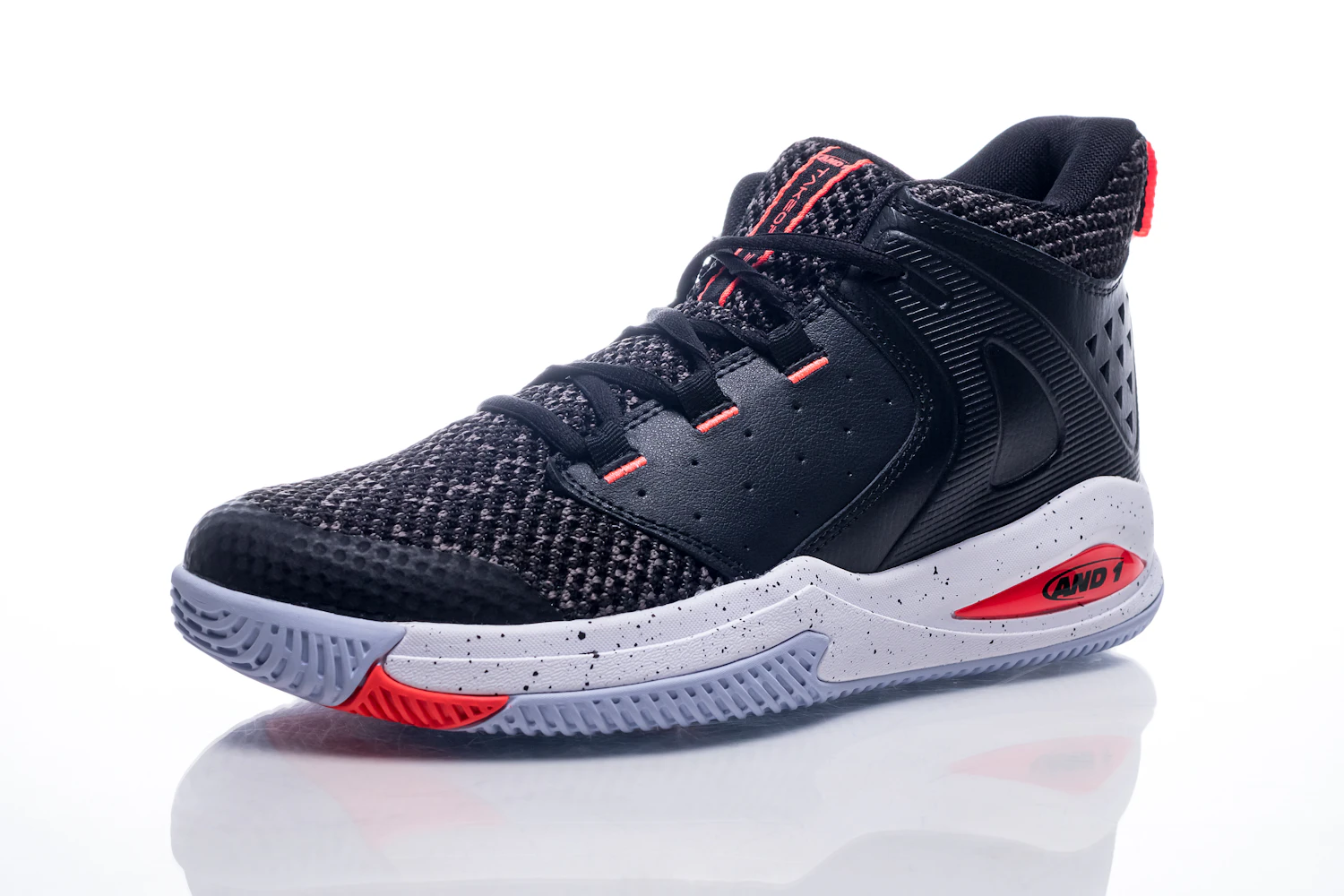 Black and red basketball shoe on a white surface