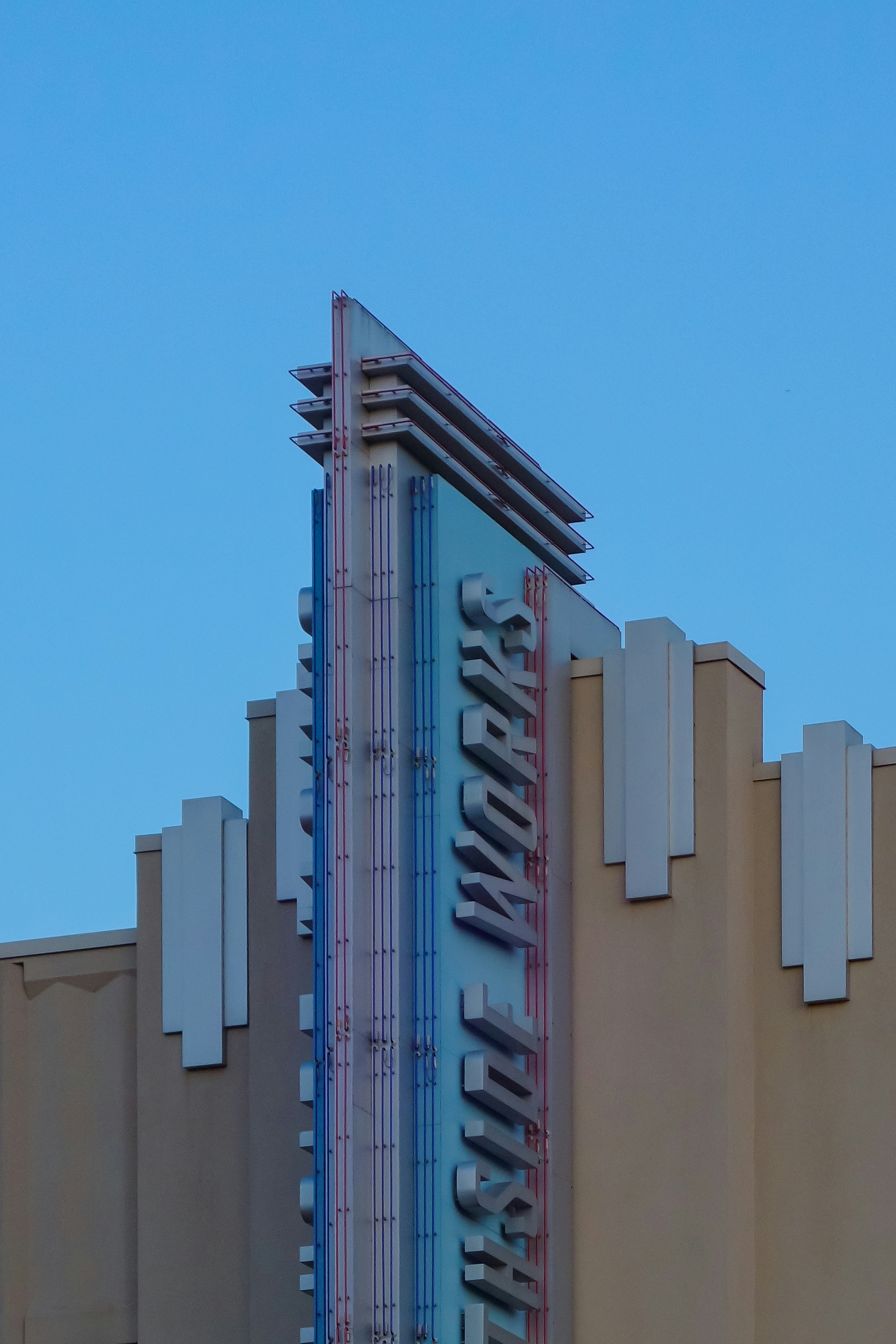 a tall building with a sign on the side of it