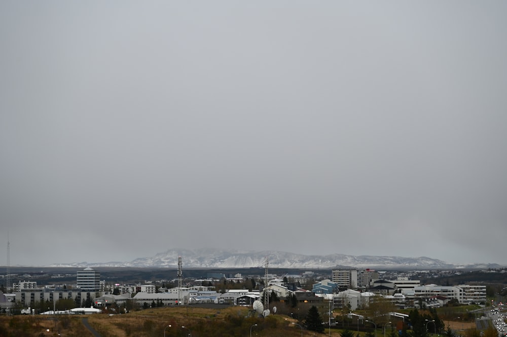 a view of a city with mountains in the background