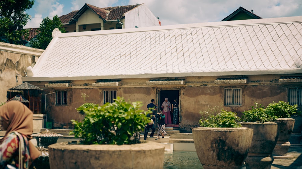 a group of people standing outside of a building