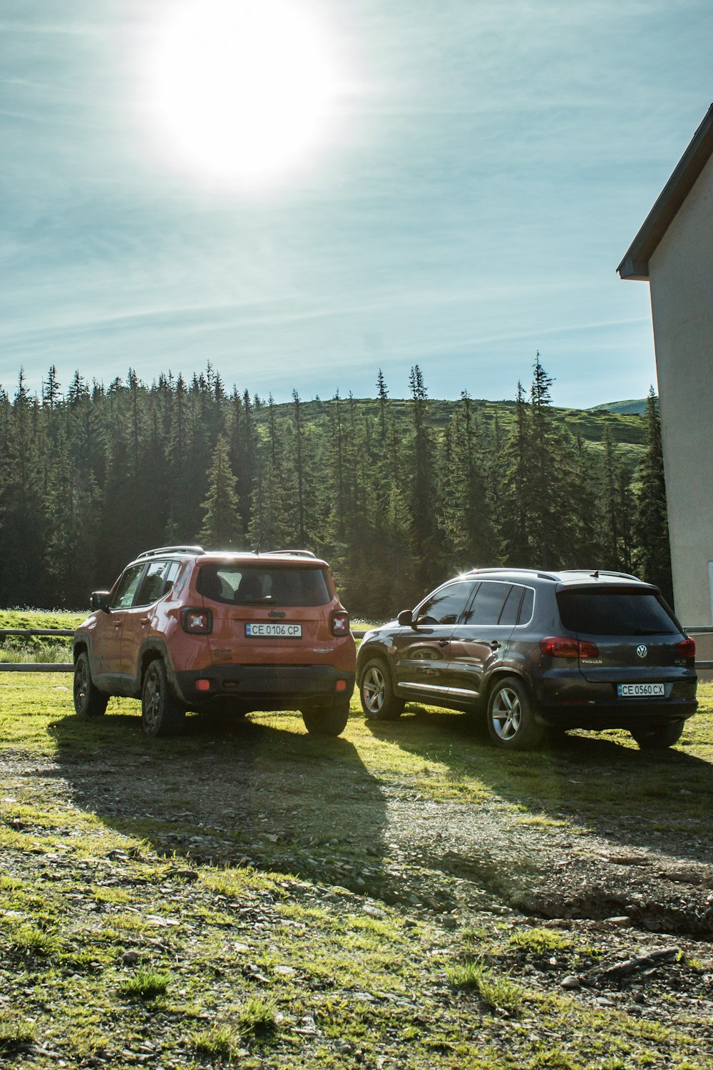 a couple of cars that are parked in the grass