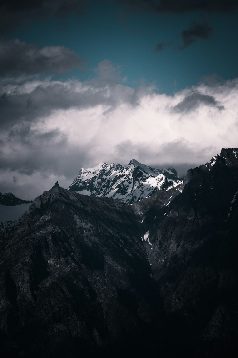 a black and white photo of a mountain range