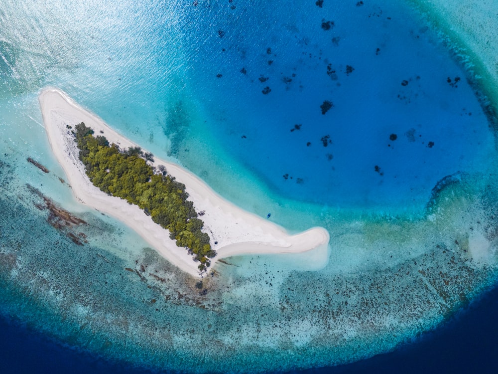 an aerial view of an island in the middle of the ocean