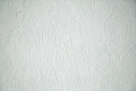 a black and white photo of a white wall