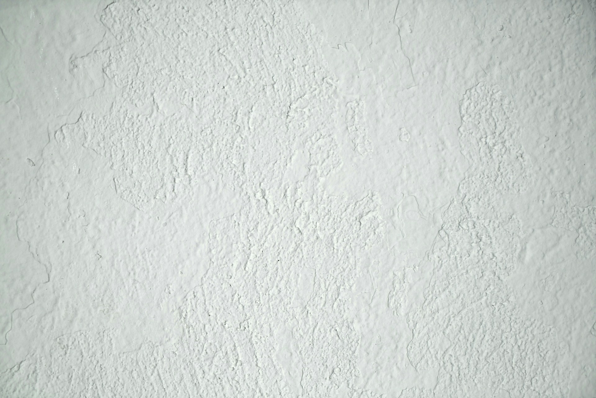 a black and white photo of a white wall