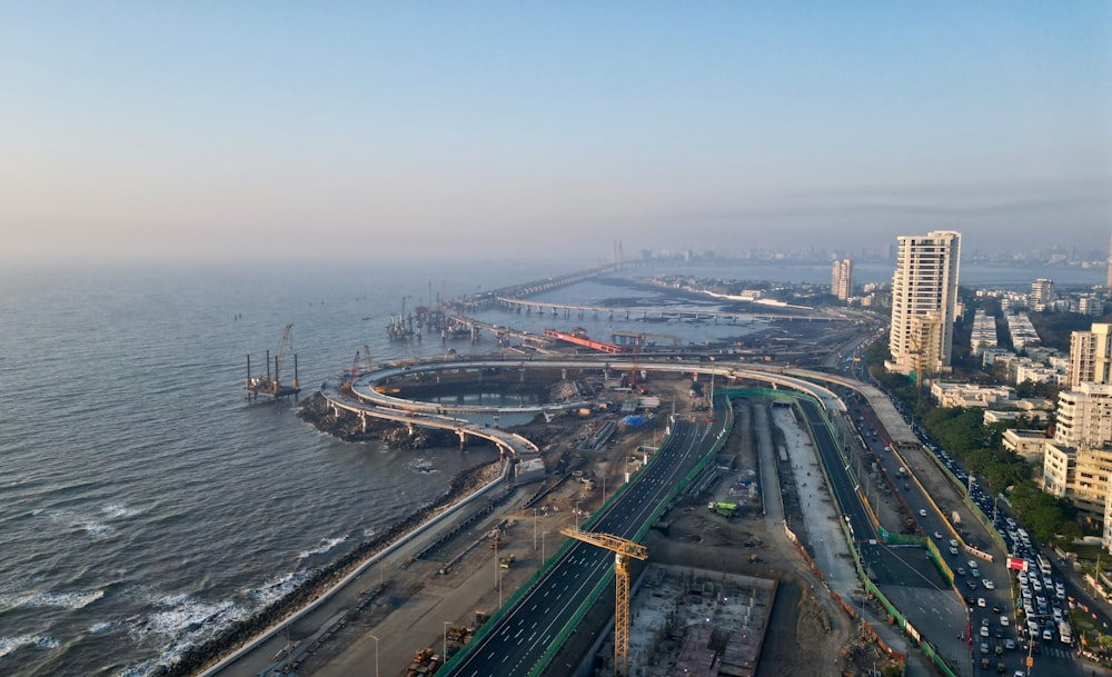 an aerial view of a city and a body of water