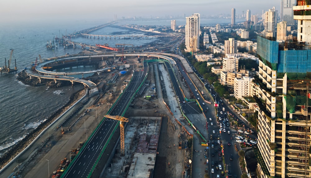 an aerial view of a city with a large body of water