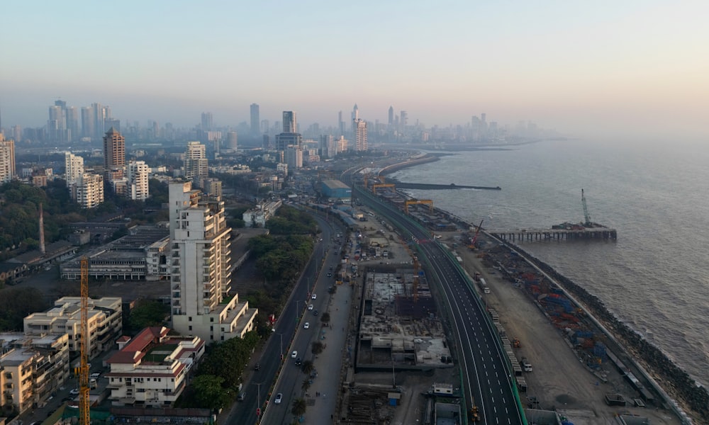 an aerial view of a city and a body of water