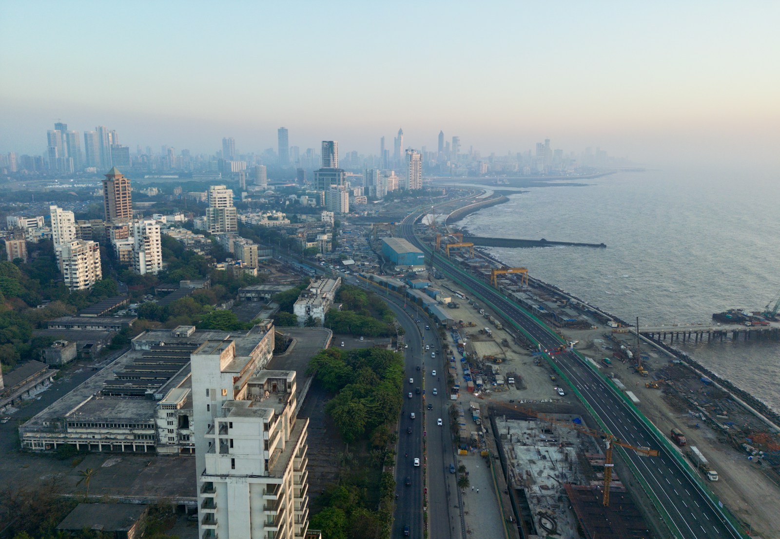 Aerial view of Mumbai buildings, coastal road, and the Arabian Sea