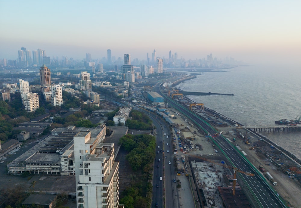 an aerial view of a city and the ocean