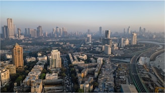 an aerial view of a city with tall buildings
