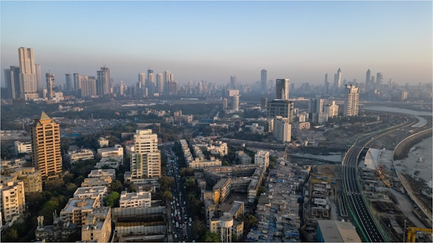 an aerial view of a city with tall buildings