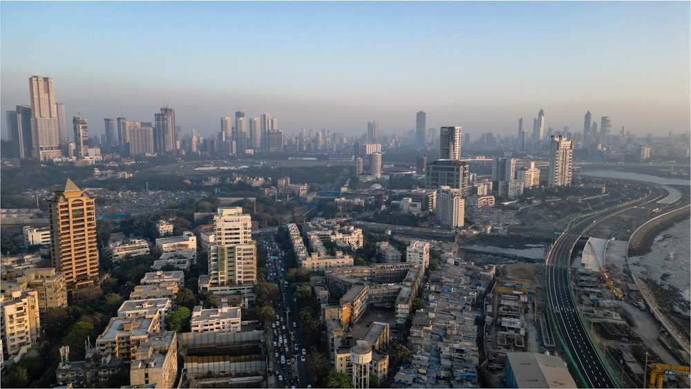 an aerial view of a city with tall buildings