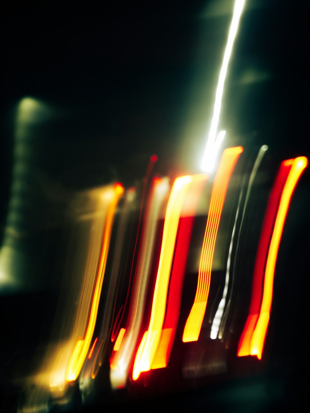 a blurry photo of a street light at night