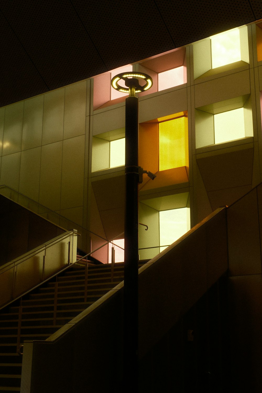 an escalator in a building at night