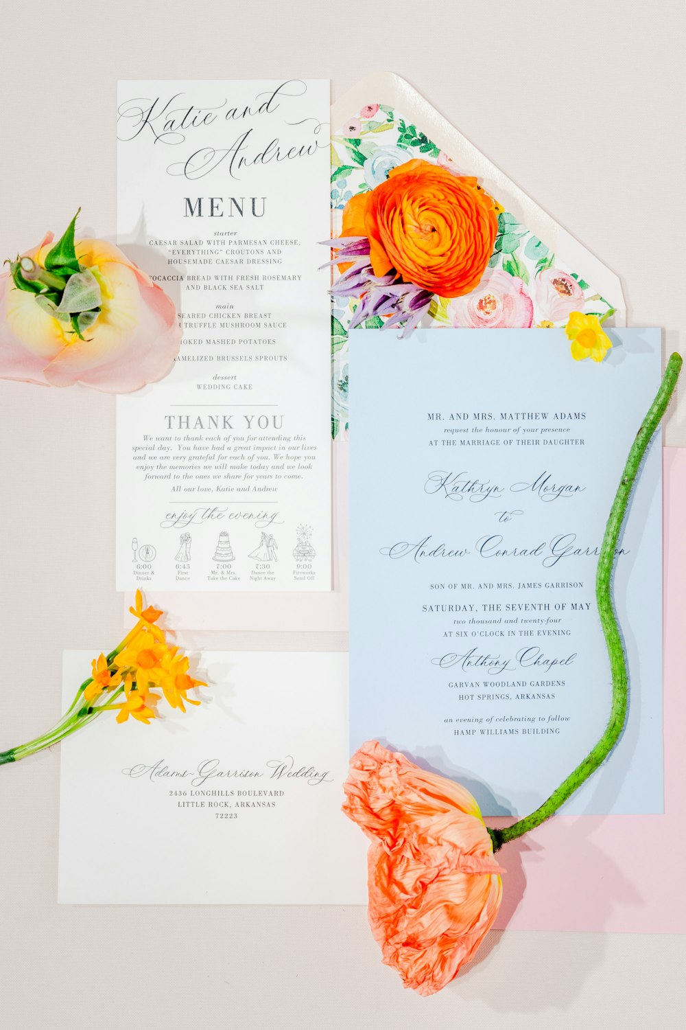 a wedding suite with flowers and a menu
