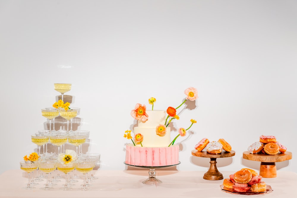 a table topped with a cake covered in frosting