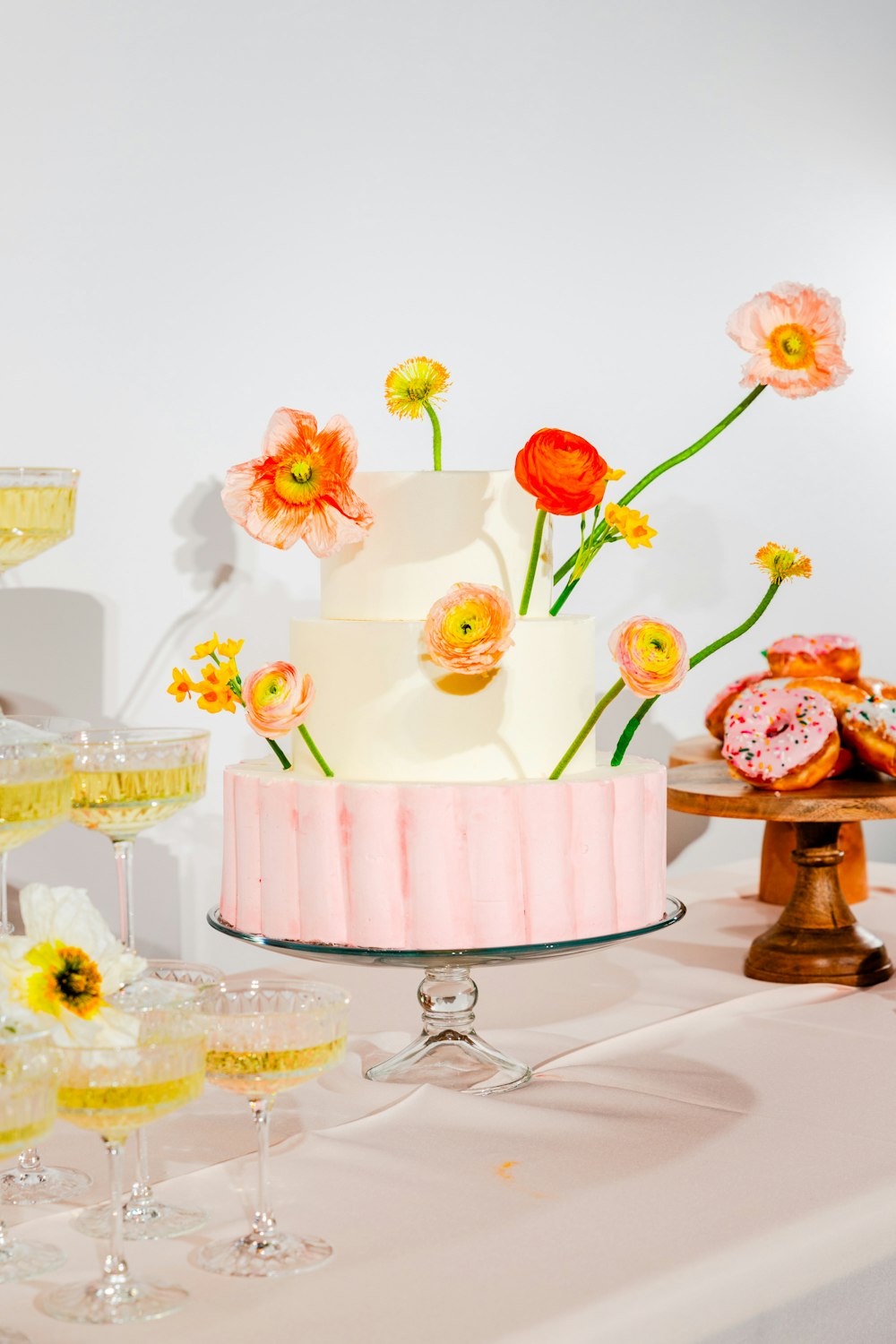 a cake with flowers on top of it on a table