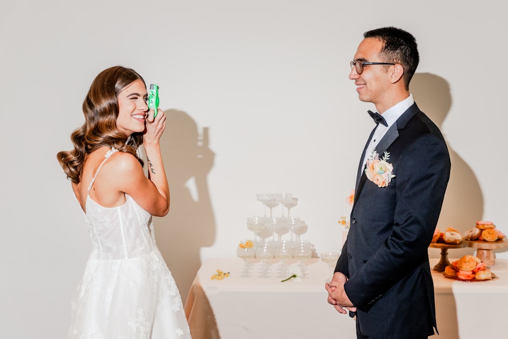 a man and woman standing next to each other