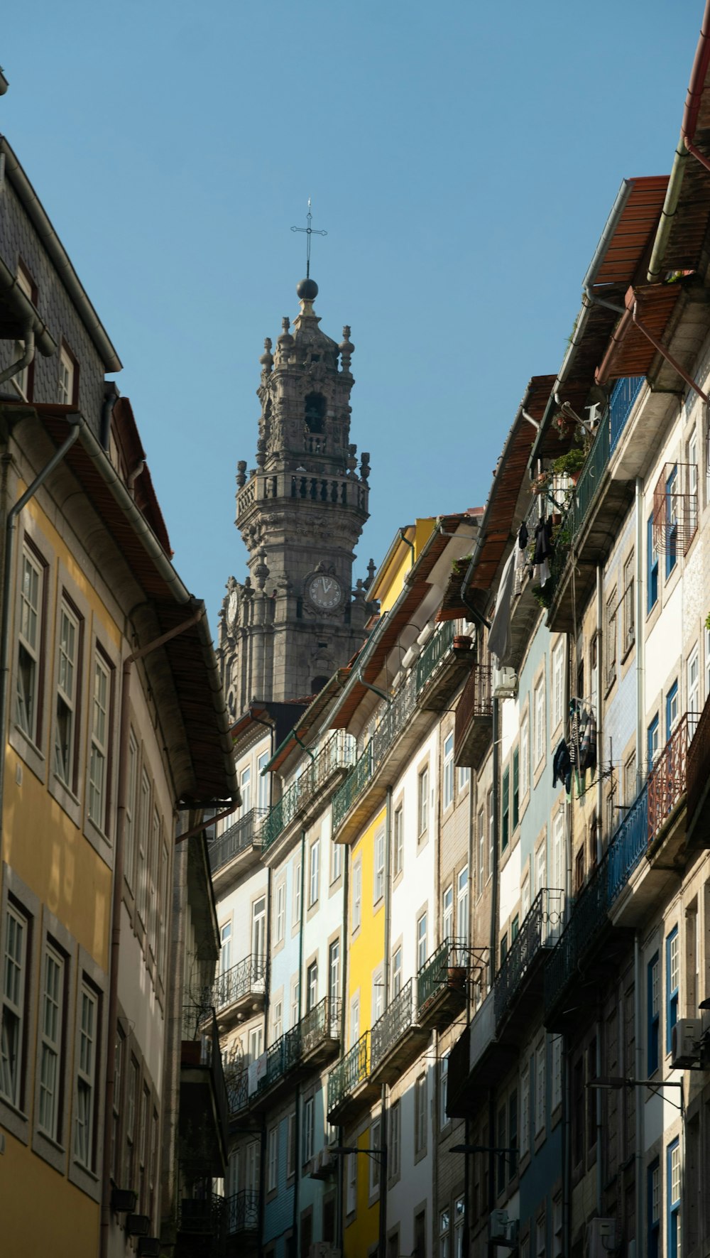 a tall clock tower towering over a group of buildings