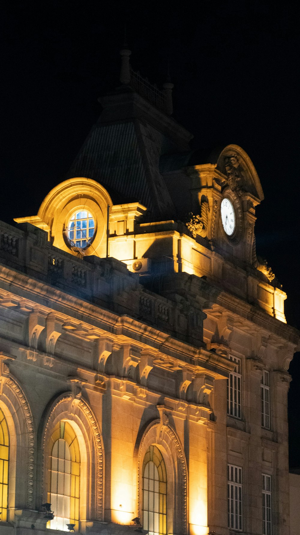 a large building with a clock at the top of it