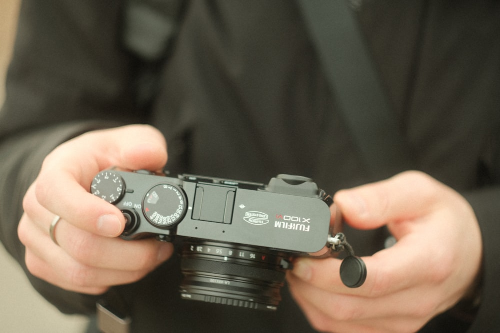 a person holding a camera in their hands