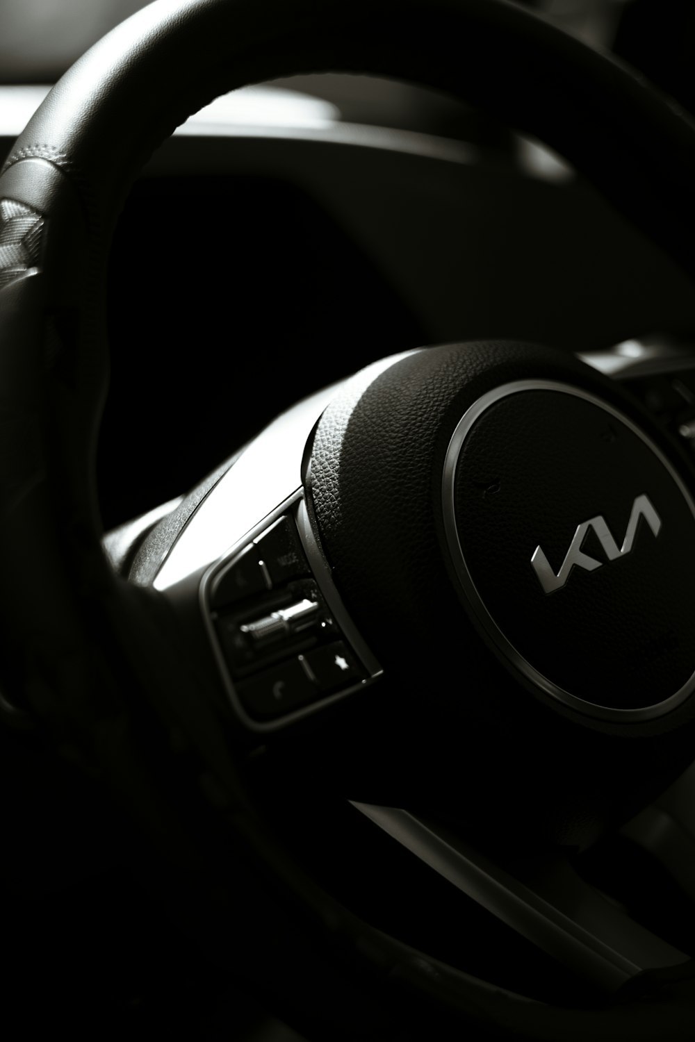 a close up of a steering wheel on a car