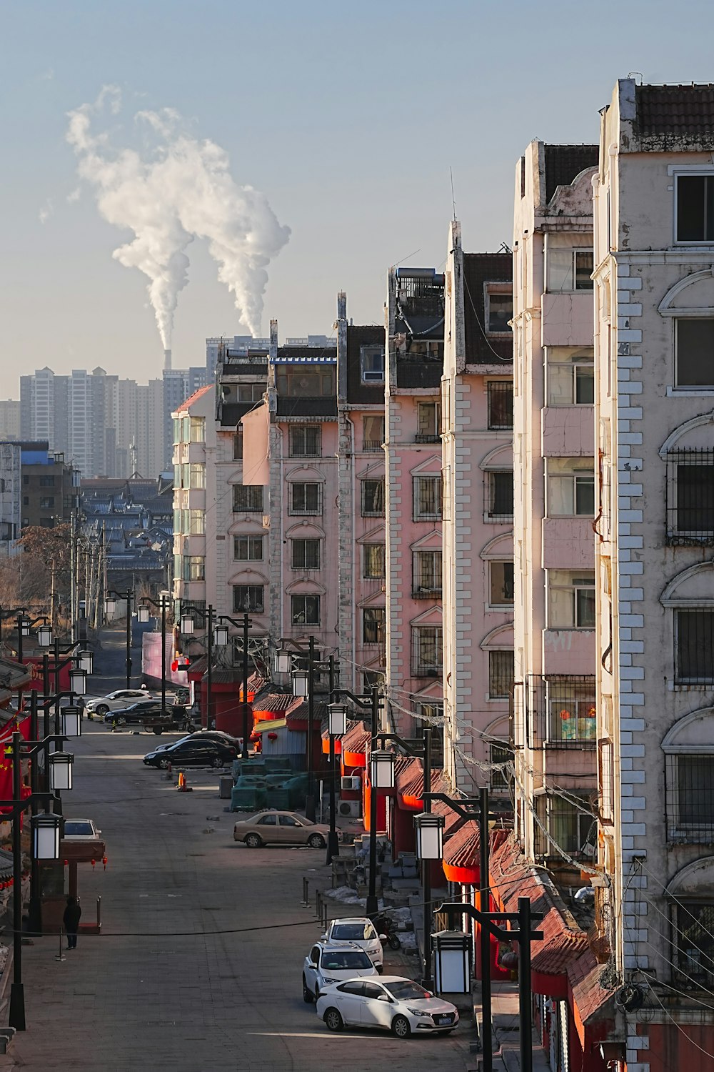 a city street lined with tall buildings and cars