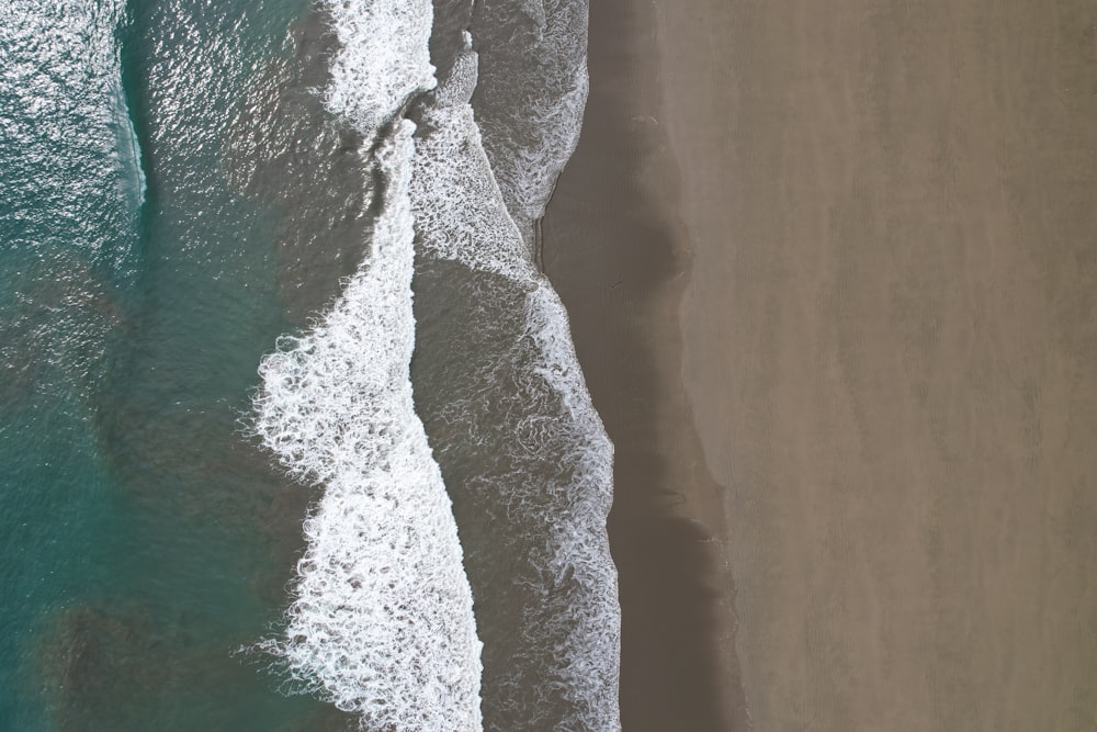 a bird's eye view of a beach and ocean