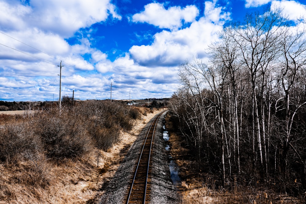 a train track in the middle of a field