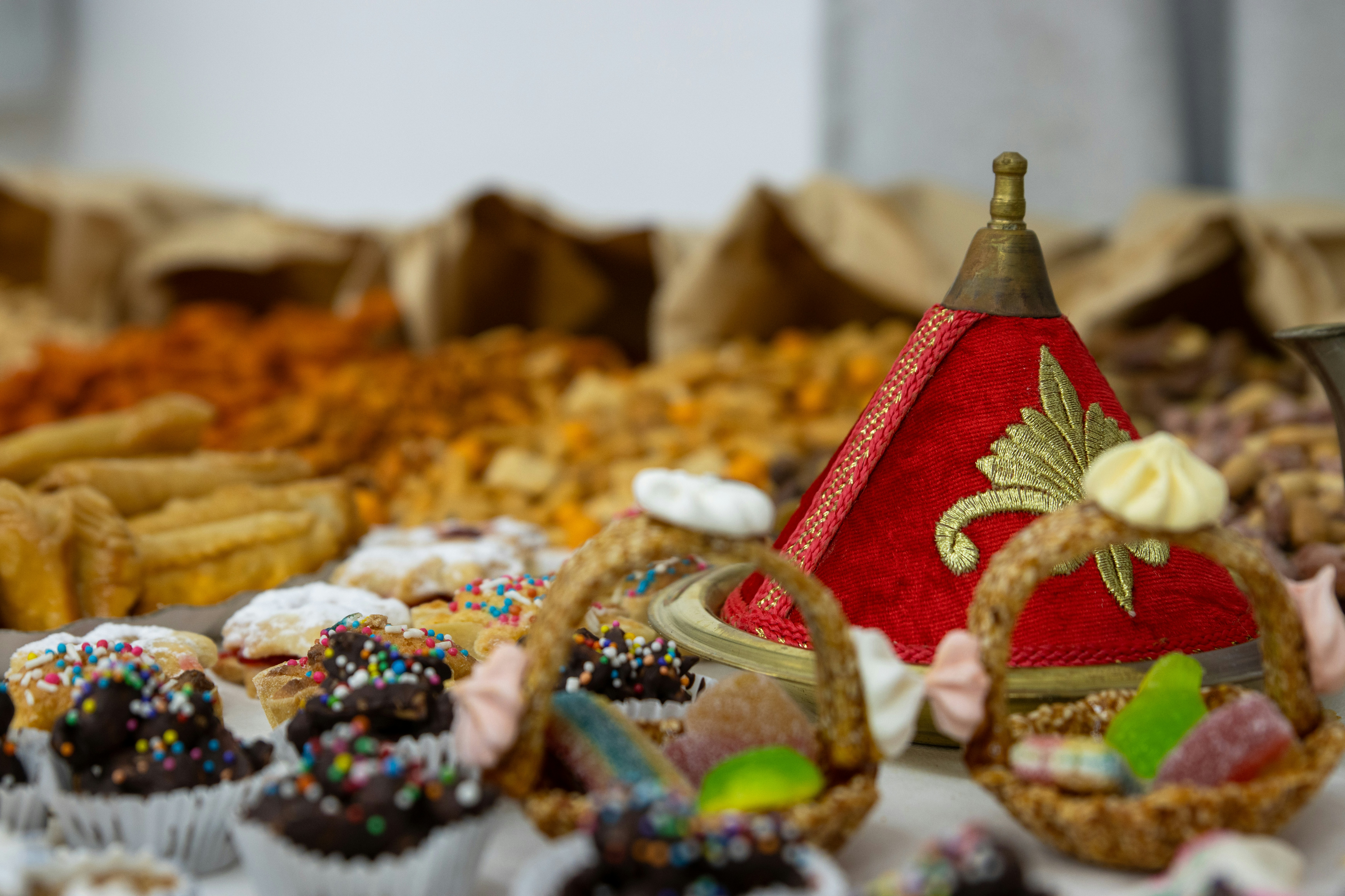 Assorted artisan pastries on a white plate, colorful seasonal ingredients, professional bakery presentation