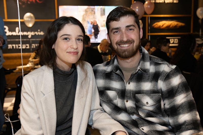 a man and a woman sitting next to each other