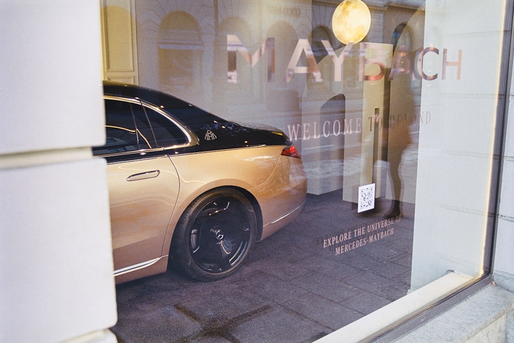 a car parked in front of a store window